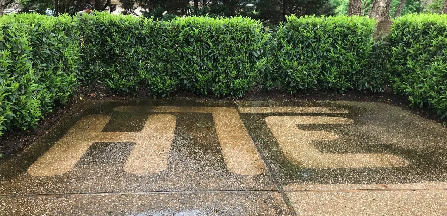We pressure washed our logo into concrete.