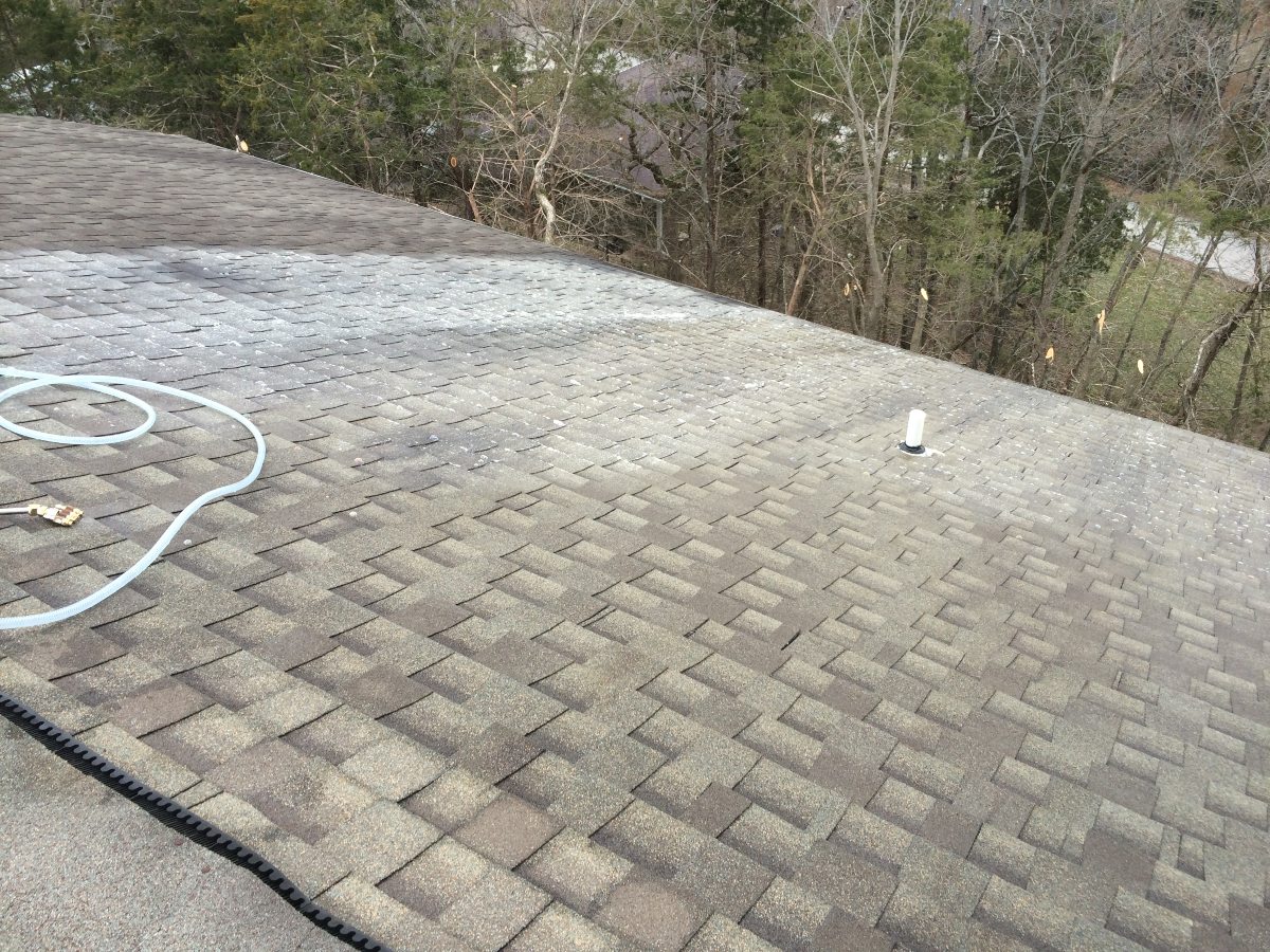 During a professional roof washing service.