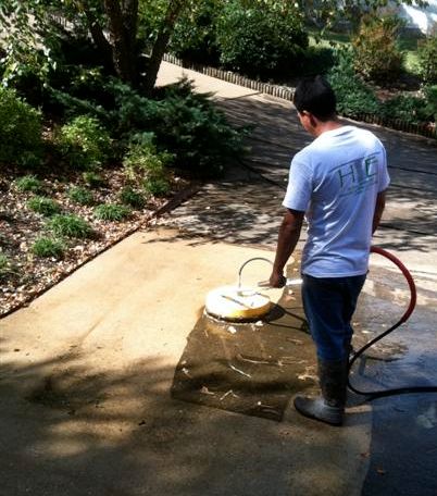 Concrete cleaning service on a walkway.