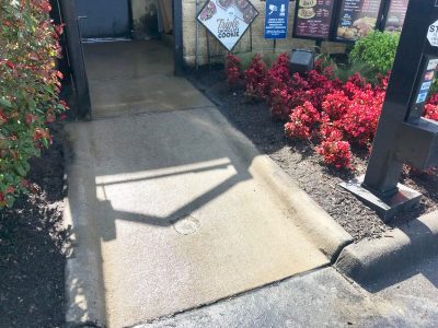 A freshly cleaned concrete walkway